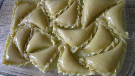 Рецепт вареников с творогом, запеченные в сливках